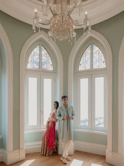 Using the beautiful arched windows and natural light at the Taj Mahal Palace to create a classic, elegant portrait. The composition feels timeless and romantic.