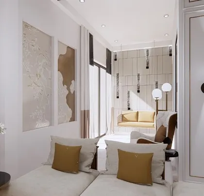 A look into a serene corner of the living area, featuring abstract art and a comfortable chaise lounge. The design uses wall mouldings and subtle lighting to create a calm and sophisticated atmosphere.