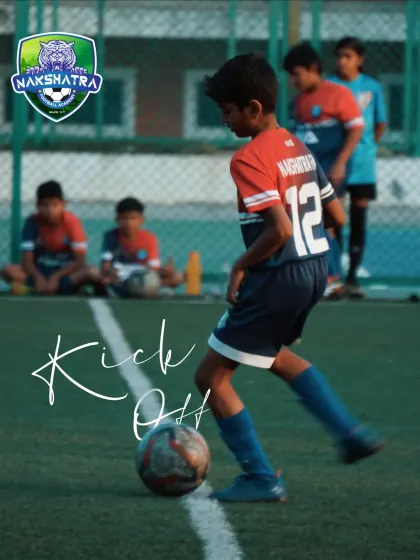 Every great match starts with a single kickoff. A young player gets ready to start a practice game, focused and prepared.