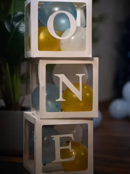 These "ONE" blocks are a simple yet effective prop to signify a first birthday. They can be placed on the floor or on a shelf as part of the main decor.