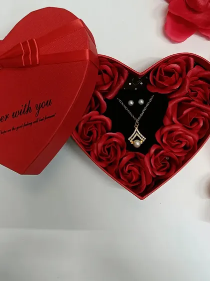 The pearl necklace set is a classic and elegant choice. The heart-shaped box makes the entire gift feel very special.
