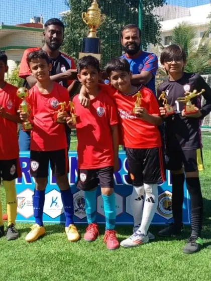 Our U10 boys with their coaches and trophies after finishing as Runners-Up at a tournament hosted by Goalfield Soccer.
