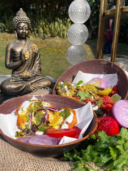 The quintessential Delhi street food, elevated. Our Aloo Tikki Chaat features a perfectly crisp potato patty, smothered in yogurt, tamarind and mint chutneys, and sprinkled with spices.