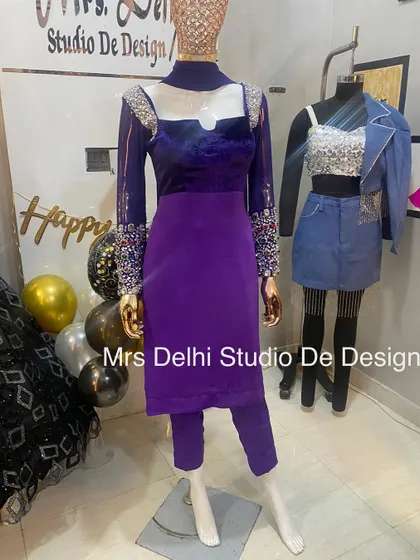 Another view of our unique royal hand-worked traditional suit. The rich purple velvet paired with sparkling stonework creates a truly memorable look.