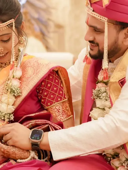 A close-up of the ring ceremony. You can see the detail in her eye makeup and the smooth, dewy finish of her skin.