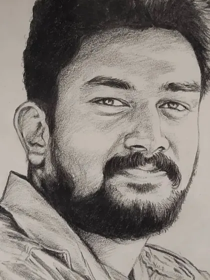 A pencil portrait sketch of a man with a beard. I focused on the texture of the hair and the friendly expression in his eyes.