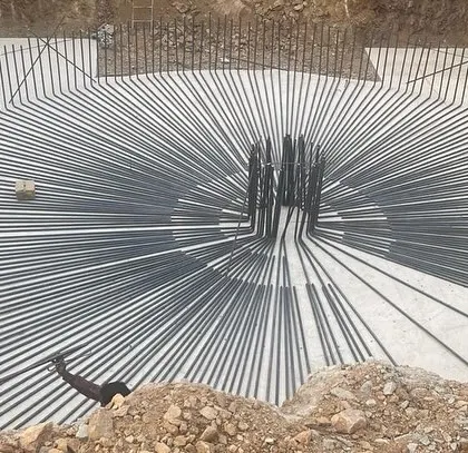 It is a pity that some of the most beautiful parts of a building are hidden. This is the steel reinforcement for the footing of the 40 meter tall "Beacon," an intricate web of rebar that forms the unseen foundation of our architectural vision.
