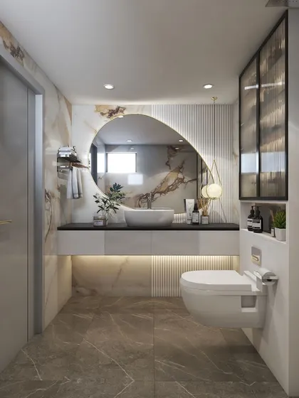 A serene oasis created with a soothing palette of cream and brown marble tiles. The floating vanity with under-lighting and the large, uniquely shaped mirror are the highlights of this space.