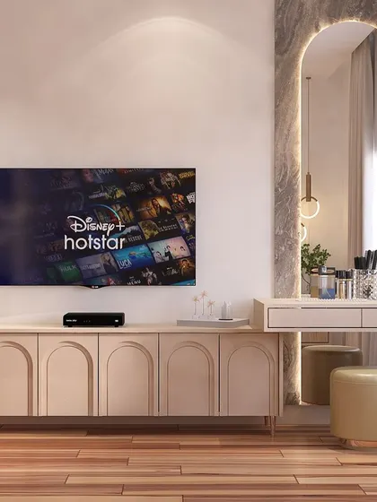 A perfect blend of elegance and function. This piece combines a TV console with arched panel doors and a sleek dressing table, united by a large, arched marble backdrop that serves as a stunning focal point.