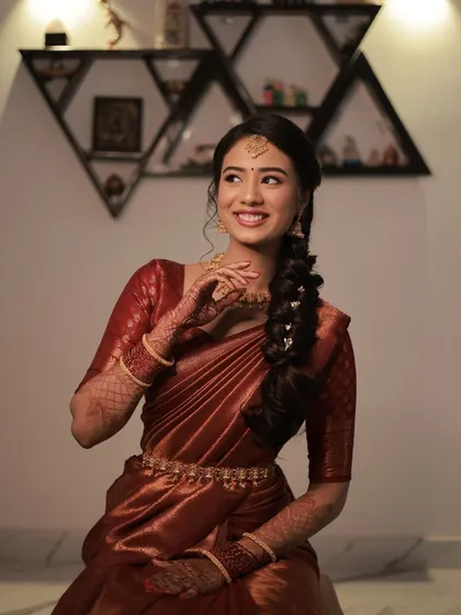 This is what I call natural, subtle, and classy. For Shruthi's engagement, I created a soft makeup look that enhanced her lovely features and paired beautifully with her elegant maroon silk saree.