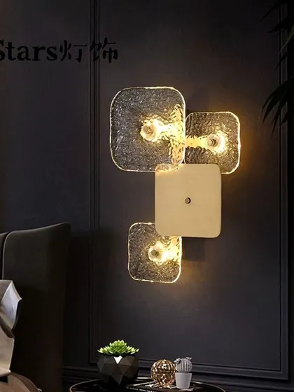 A unique wall sconce featuring a cluster of textured glass squares. This fixture is a piece of modern art for your wall.