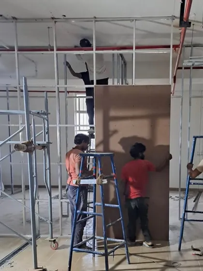 The DHL office during construction. This shot shows the installation of partitions, a crucial step in defining the layout and flow of the workspace.