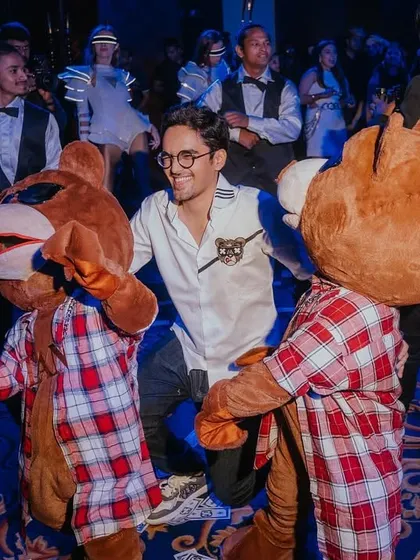 Guests dancing with the mascots, fully embracing the playful and high-energy vibe of the Toy Room Club themed party.