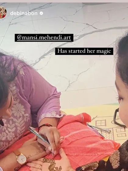 A behind the scenes shot of me starting the "magic" for Debina Bonnerjee's Karwa Chauth mehendi, as shared by her on social media.
