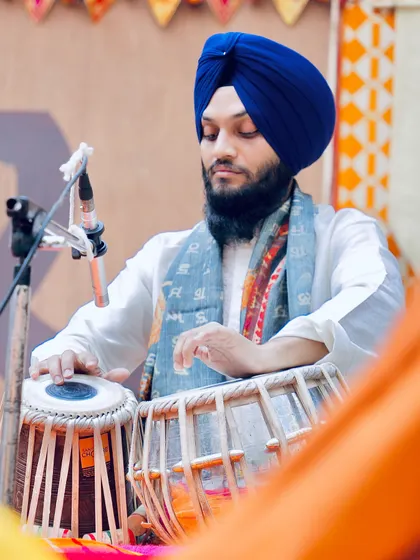 A side view of my performance in Delhi, with the traditional Indian textiles creating a vibrant setting.