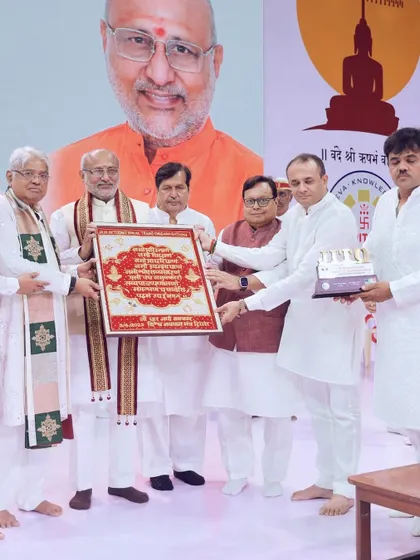 Dignitaries presenting a plaque on stage, a key moment of felicitation during the event. We help structure event flows to include important ceremonies like this.