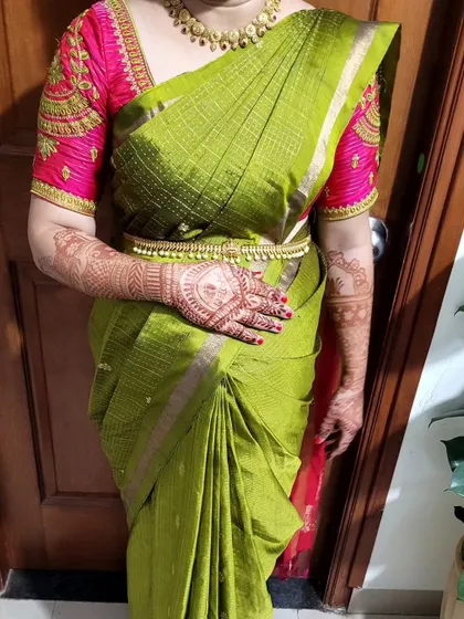 Saree draping for new mom Sowmya. The drape is styled to be comfortable and easy to manage, perfect for post-pregnancy events or ceremonies.