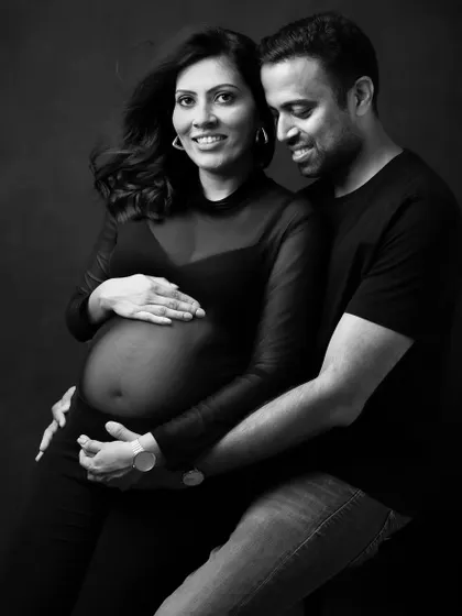 The shared joy and connection in this pose is the complete focus of the image in black and white.