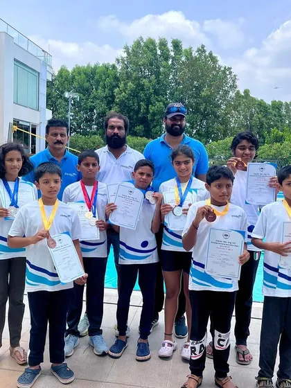 A duplicate image of our medal winners and coaches.