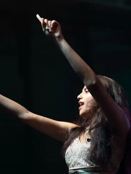 Reaching for the high notes. A shot that captures the passion and effort that goes into every single performance.