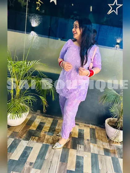 A happy client in a lavender chikankari suit. This is a perfect example of a light and airy outfit for a summer festival or daytime event.