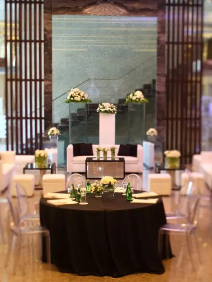 A mixed-seating arrangement for a corporate social event, combining formal tables with a relaxed lounge area. This versatility allows us to create different zones within a single event to cater to various activities and moods.
