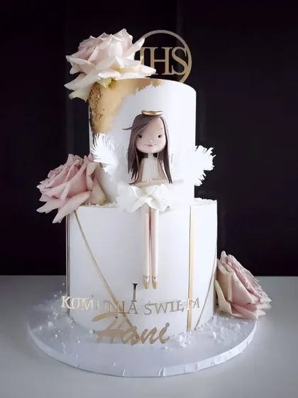 A two-tiered angel-themed dreamy cake, perfect for a baptism or other special religious occasion.