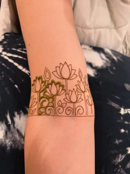 The outline of a lotus garden arm band. This is the blueprint for the final, filled-in design.