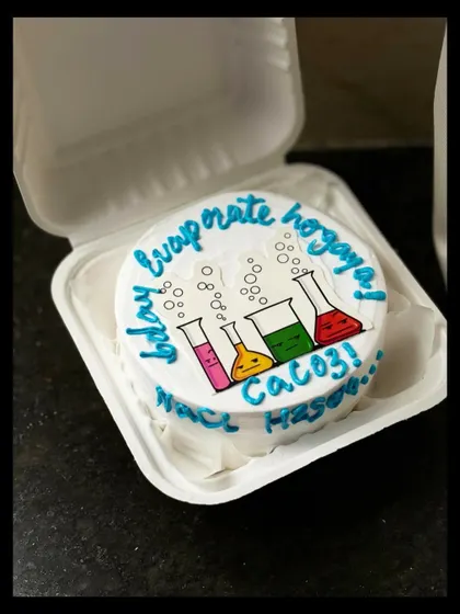 Another look at the fun science-themed bento cake. The colorful beakers and bubbles make it a visually appealing and unique design for any science enthusiast.