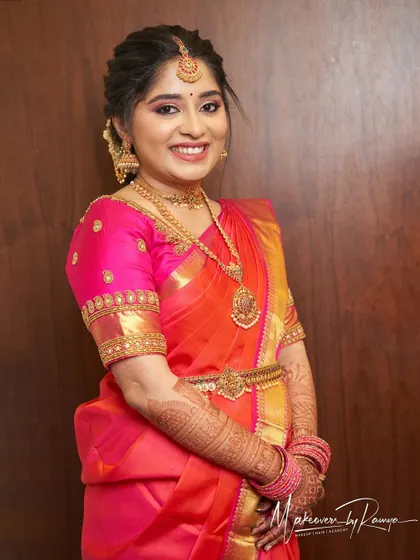 Vidhatri's radiant smile captures the joy of her wedding day.