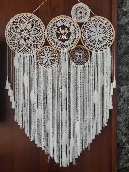 There is a divine purity to the color white. This all-white cluster dreamcatcher, personalized for 'Yash' and 'Akki', is a testament to timeless elegance and bohemian grace.