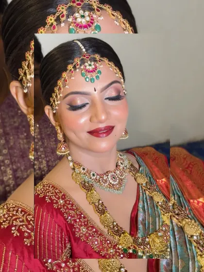 A beautiful bridal portrait showcasing a layered kemp jewellery set. The matha patti and matching necklaces create a look that is both traditional and striking.