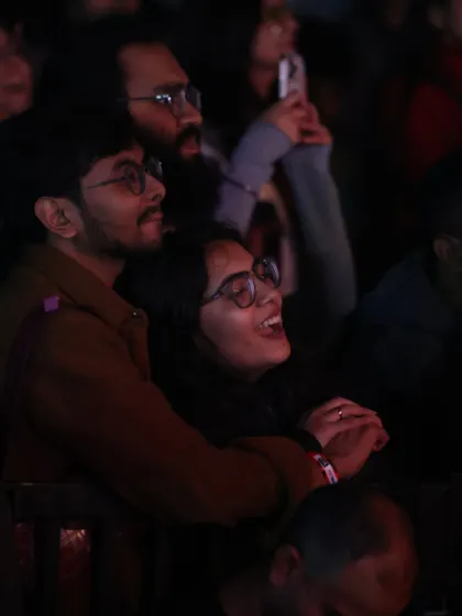 A couple enjoying the concert together, lost in the moment. Our events are perfect for making memories with the people you care about.