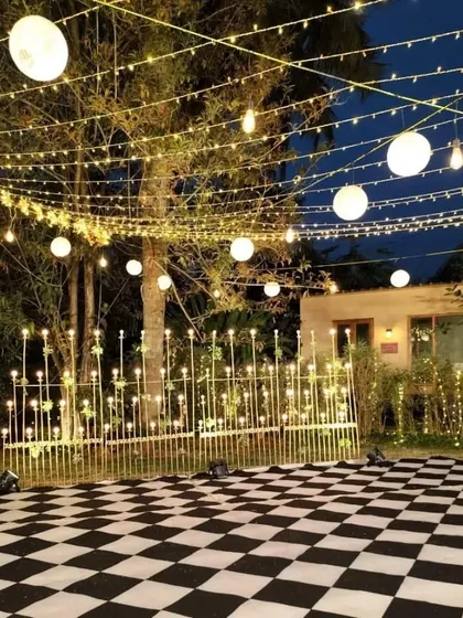 Another view of the checkered dance floor and lighting setup, showing how we create a dedicated space for performance and dancing that becomes the center of the party.