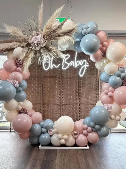 A full view of the popular circular baby shower backdrop. It's a versatile piece that can be customized to fit any color scheme.