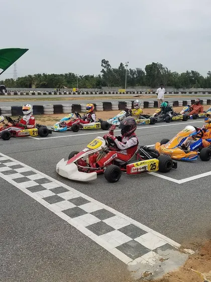 The start of a race in the Rotax Indian Championship. Our drivers are positioned at the front of the grid, ready to compete for the win.