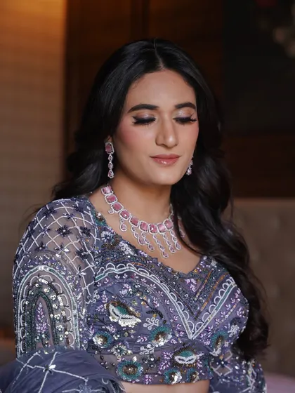 Learning to create elegant engagement or reception looks is a key part of my pro course. This look features soft purple tones on the eyes, paired with a radiant skin finish and a complementary pink necklace.
