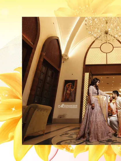 A romantic gesture captured during an engagement party, with the groom on one knee. The grand architecture of the venue adds to the drama and elegance of the shot.