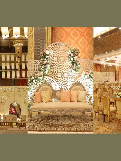More details of the golden decor, focusing on the stage seating and the overall ballroom ambiance, defined by white, gold, and floral accents.