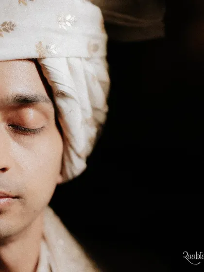 A quiet, contemplative close-up of the groom just before the ceremony, capturing the emotion of the moment.