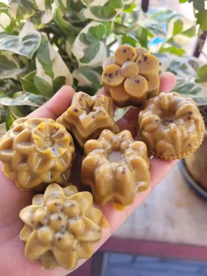 A handful of my assorted facial soaps. Each one is uniquely shaped and formulated with different natural ingredients to target specific skin concerns.