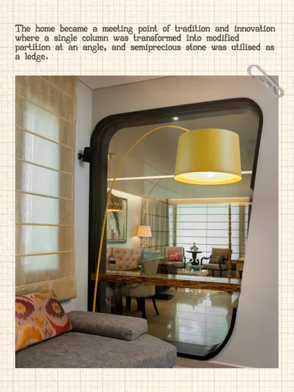 A cozy reading nook in the Modi Residence, viewed through a custom-designed partition. The pop of yellow from the floor lamp adds a cheerful accent to the neutral color scheme.