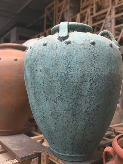 The classic 'Gentong' planter is now available in a beautiful new teal hue with a distressed finish.