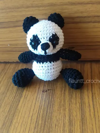 This little panda is sitting up all on his own. The flat base and balanced design make him a great little decorative toy for a shelf or desk.