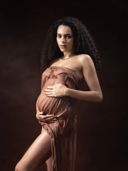 A bold and artistic wet look maternity portrait. This style is for mothers who want to break the mold and create a powerful, unforgettable image of their pregnancy journey.