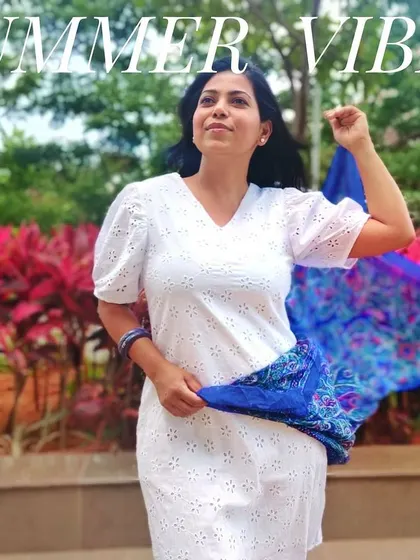 Another way to style a little white dress for summer is with a colorful scarf. Here, I've used a vibrant blue printed scarf to add movement and personality to this simple, classic look.