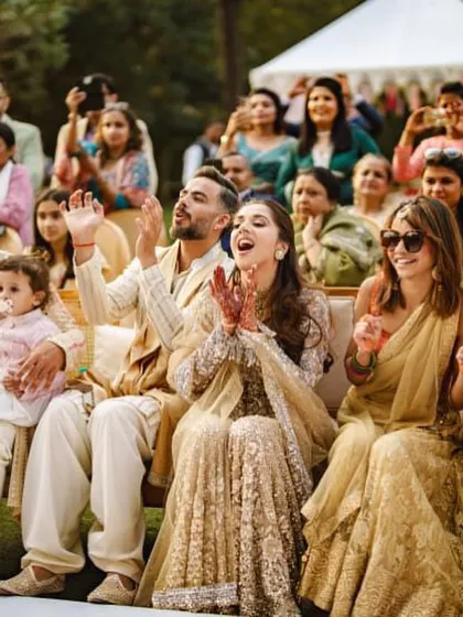 The bride and groom's reaction says it all. Pure joy and happiness watching their loved ones perform.