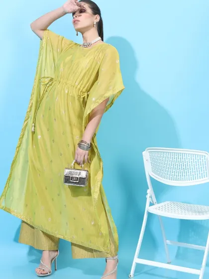 A modern ethnic kaftan set I styled for Visudh. The lime green color and relaxed silhouette, paired with a mini handbag and heels, create a chic and comfortable festive outfit.