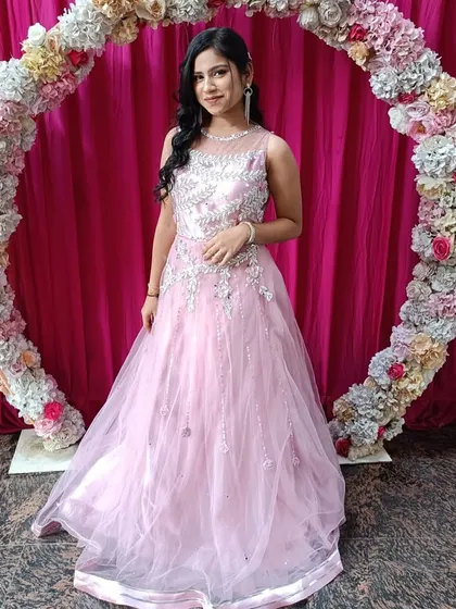 Simple, elegant, and beautiful. This client chose a light pink net gown with silver embroidery for her event. It’s a great rental option for a sophisticated evening look.