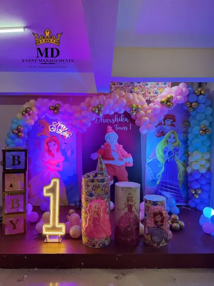 Another view of the Disney Princess birthday stage, highlighting the different lighting effects on the balloon arch and backdrops.